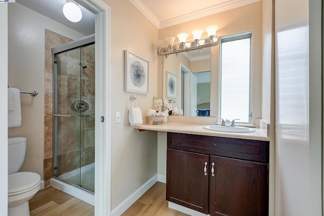 bathroom featuring crown molding, a shower with shower door, toilet, and hardwood / wood-style flooring