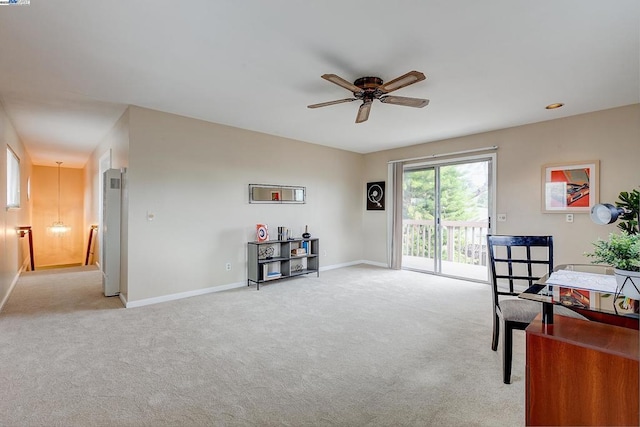 misc room with light carpet and ceiling fan