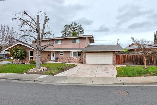 view of front facade with a garage and a front lawn