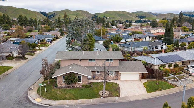 birds eye view of property with a mountain view