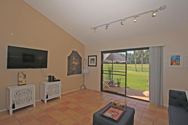 living room with tile patterned floors and vaulted ceiling