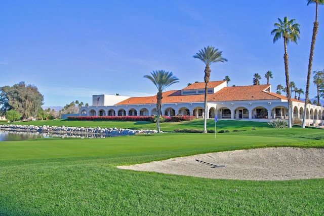 view of property's community featuring a yard and a water view