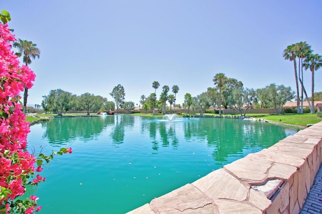 view of pool featuring a water view