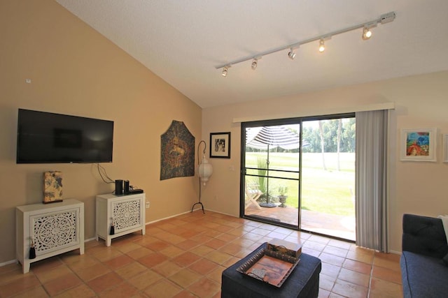 living room featuring vaulted ceiling and light tile patterned floors