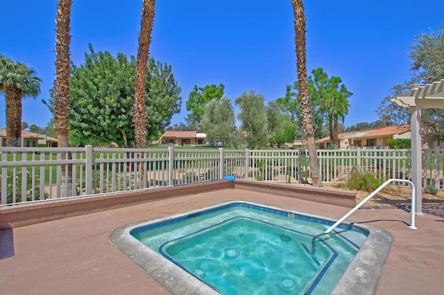 view of pool with an in ground hot tub and a patio