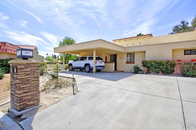 view of front of property with a carport