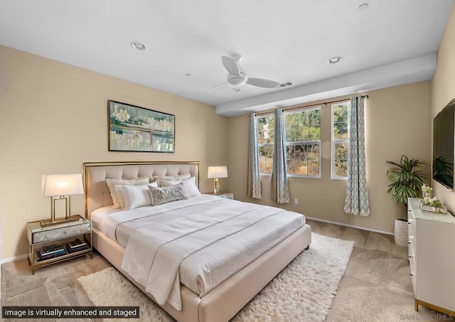 bedroom with light colored carpet and ceiling fan