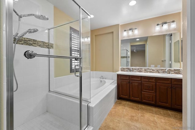 bathroom featuring tile patterned floors, vanity, plus walk in shower, and backsplash