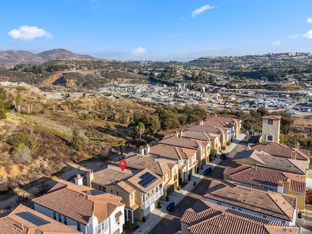 birds eye view of property with a mountain view