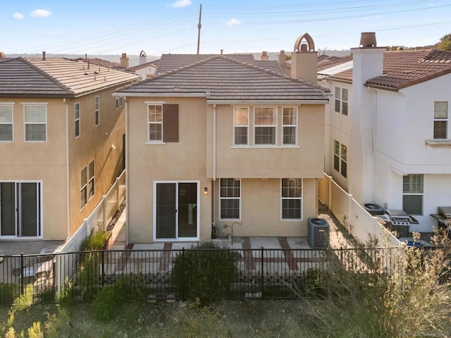 back of property featuring cooling unit