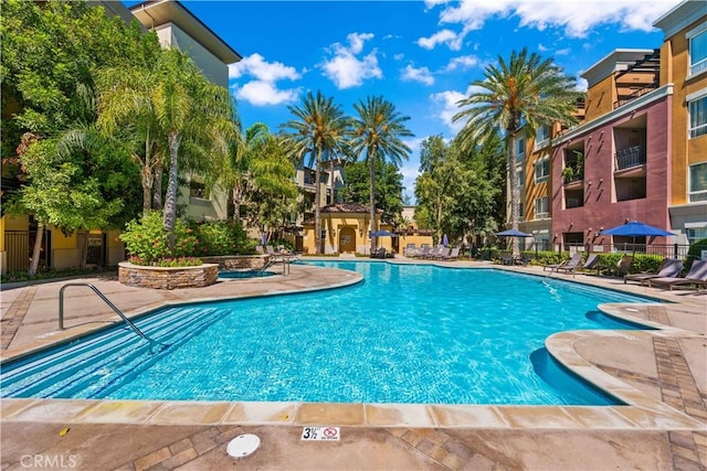 view of swimming pool with a patio area