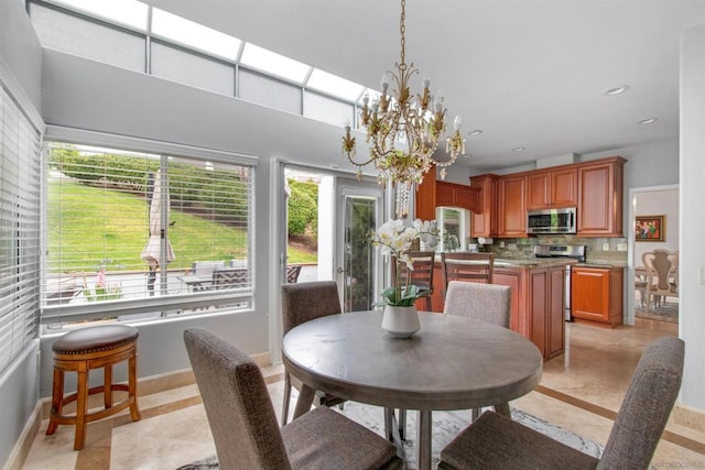 dining room featuring plenty of natural light and a chandelier