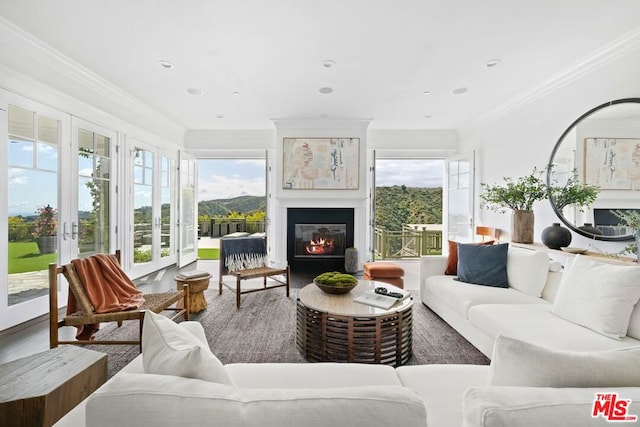 sunroom / solarium with a mountain view and a wealth of natural light