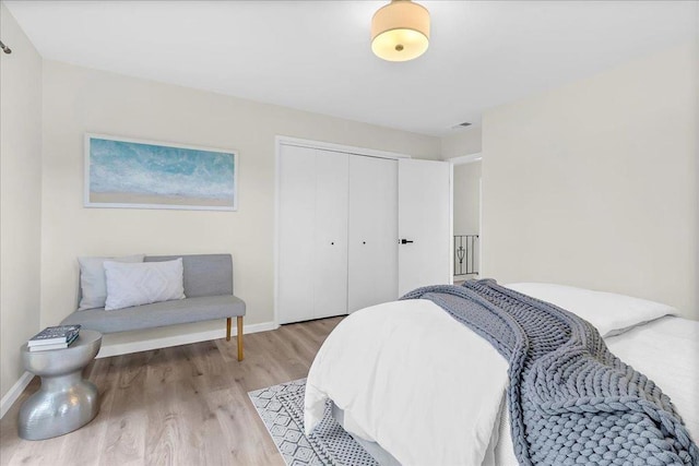 bedroom featuring a closet and light wood-type flooring