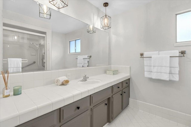 bathroom with vanity and an enclosed shower