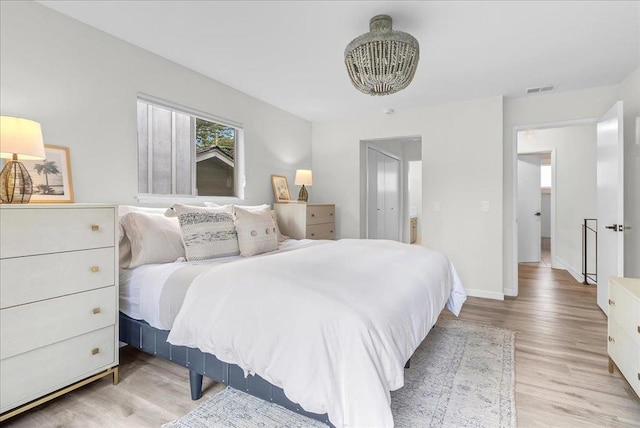 bedroom with light hardwood / wood-style floors