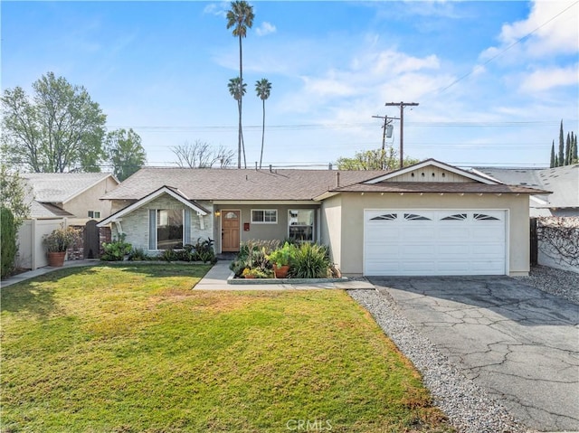 single story home featuring a garage and a front lawn