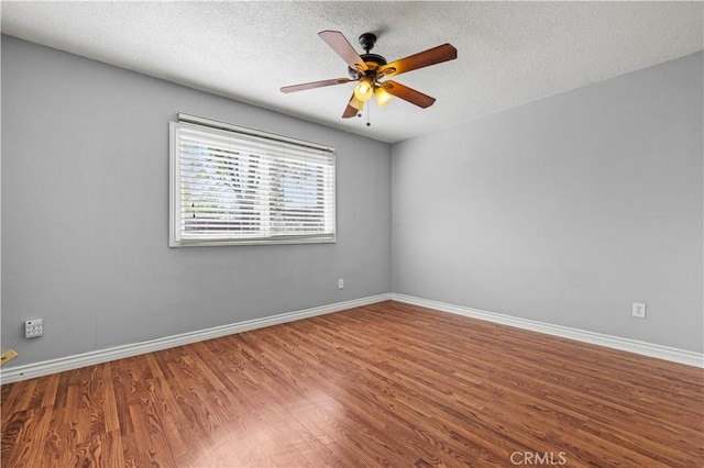 unfurnished room featuring wood-type flooring, a textured ceiling, and ceiling fan