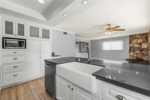 kitchen with white cabinetry, sink, light hardwood / wood-style flooring, and stainless steel appliances