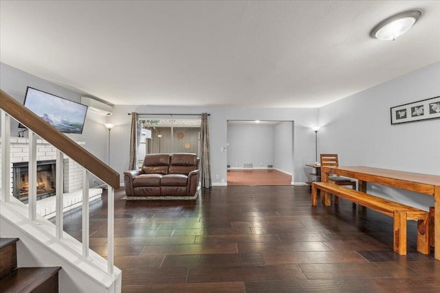 interior space featuring a fireplace and dark hardwood / wood-style flooring