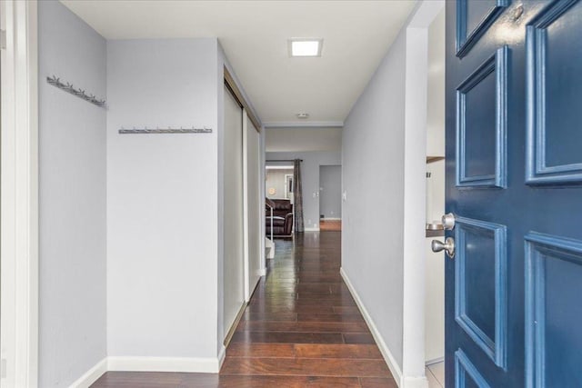 hallway with dark wood-type flooring