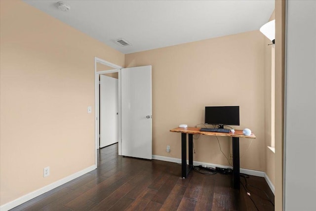 unfurnished office featuring dark wood-type flooring