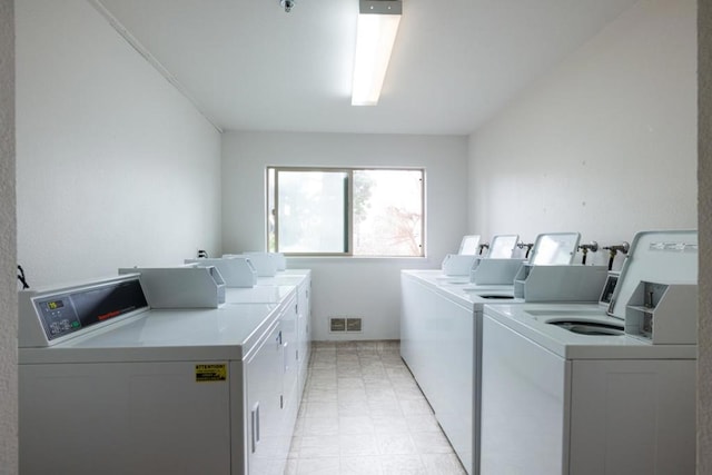 laundry room featuring independent washer and dryer