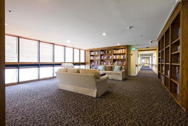 unfurnished living room featuring floor to ceiling windows and carpet