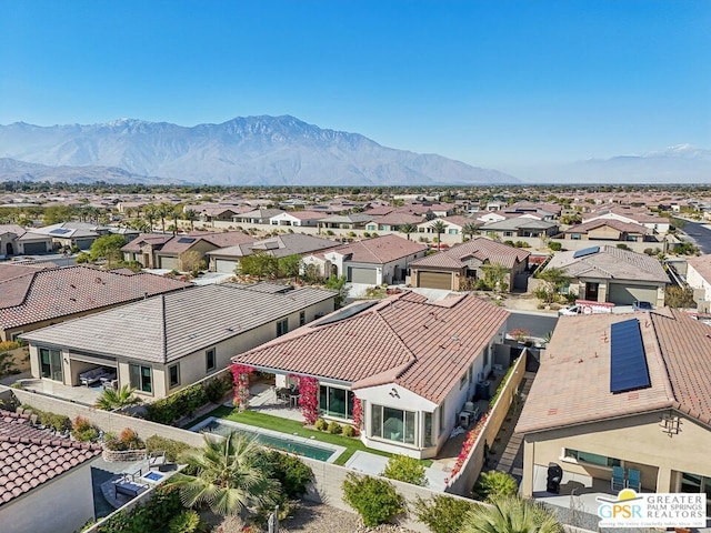 birds eye view of property featuring a mountain view