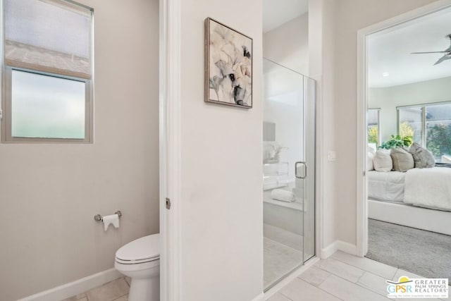 bathroom featuring tile patterned flooring, walk in shower, ceiling fan, and toilet