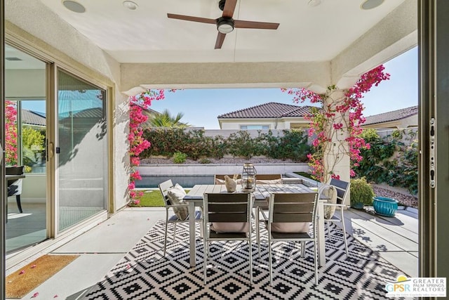 view of patio featuring ceiling fan