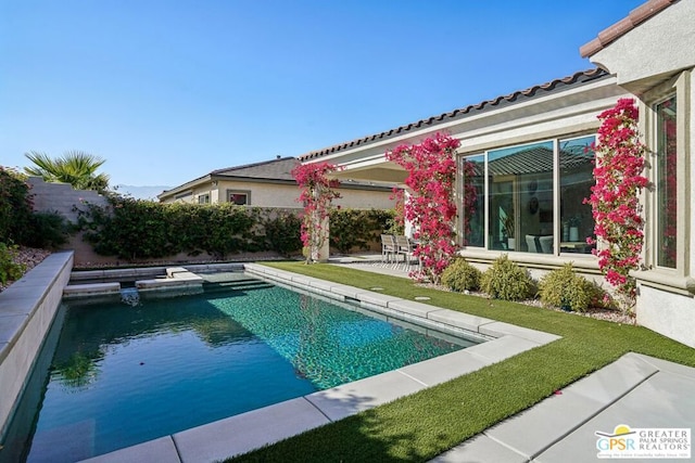 view of swimming pool with a patio area