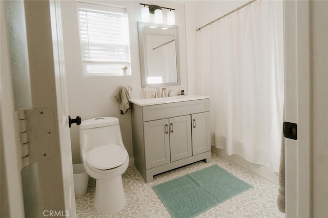 full bathroom with vanity, toilet, tile patterned flooring, and shower / bath combo