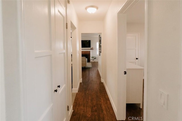 hallway with dark wood-type flooring