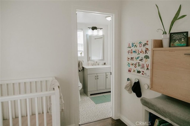 bathroom featuring vanity and toilet