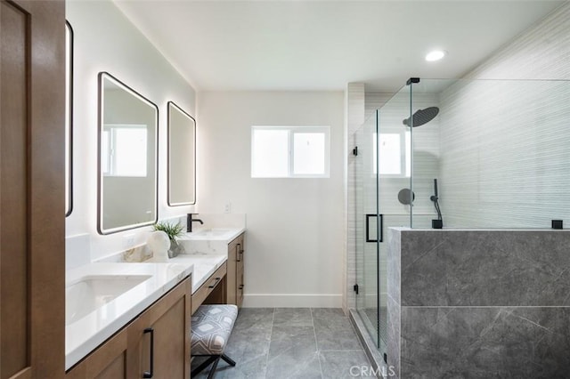 bathroom with walk in shower and vanity