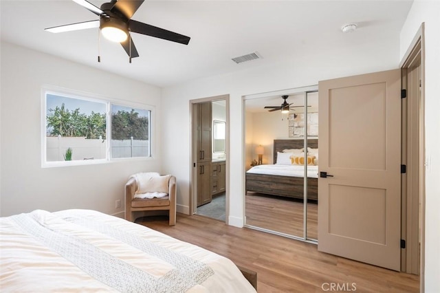 bedroom featuring hardwood / wood-style flooring and ceiling fan