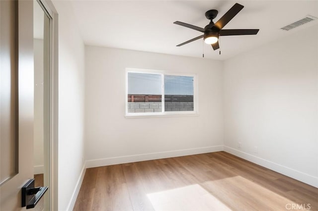 unfurnished room with ceiling fan and light wood-type flooring