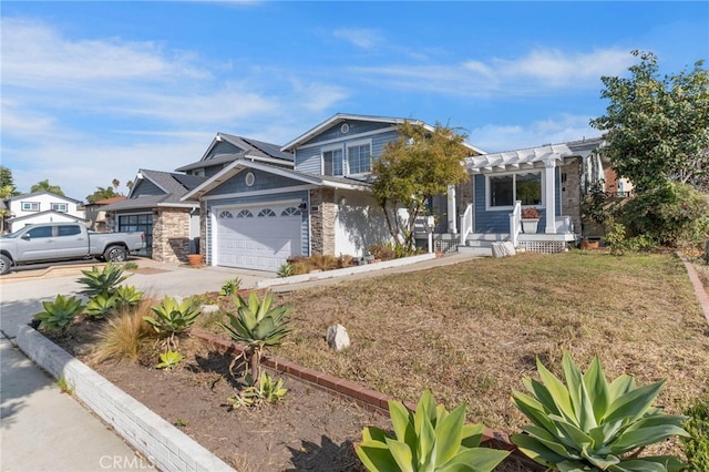 view of front of property featuring a garage and a pergola