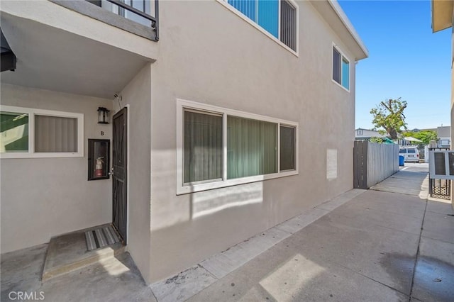 233 W Oliver St, San Pedro, CA 90731 - view of home's exterior with stucco siding and a patio