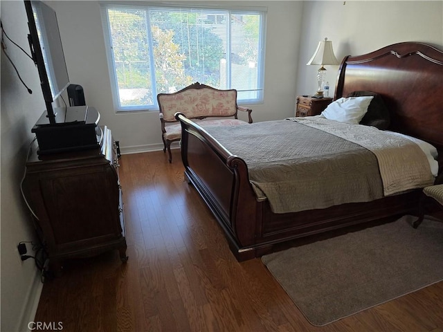 bedroom featuring dark hardwood / wood-style floors