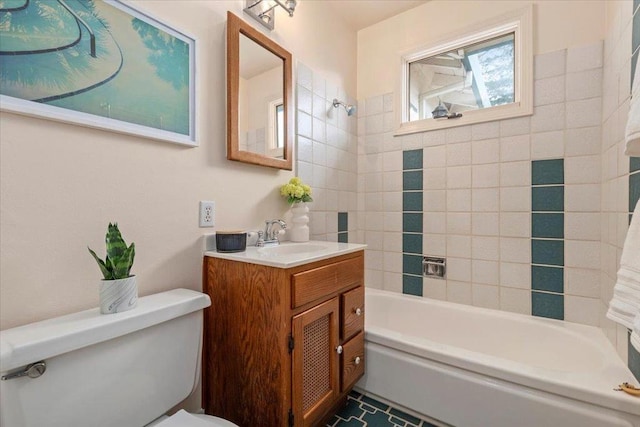 full bathroom with vanity, toilet, and tiled shower / bath combo