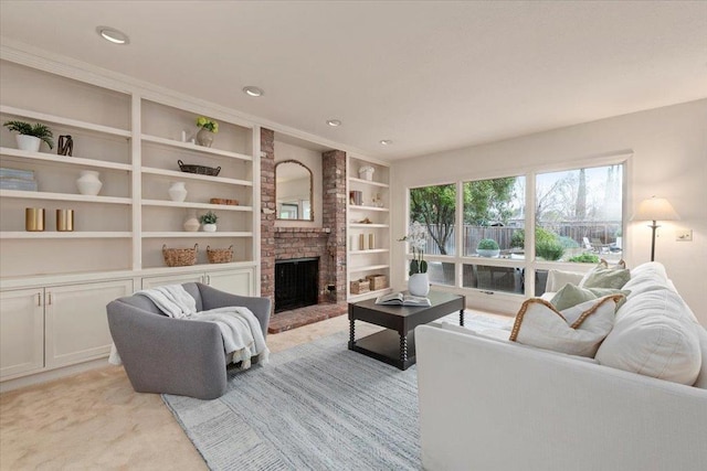 carpeted living room with a brick fireplace and built in features