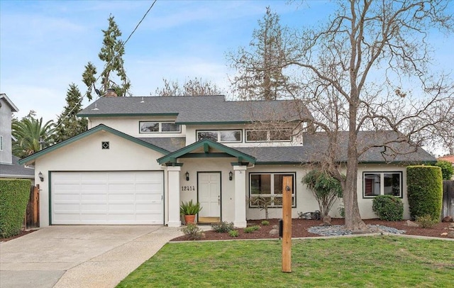 view of front of house featuring a garage and a front lawn