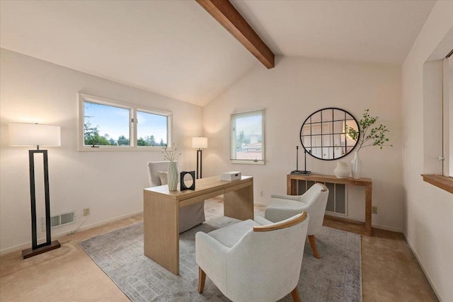 carpeted office space featuring vaulted ceiling with beams