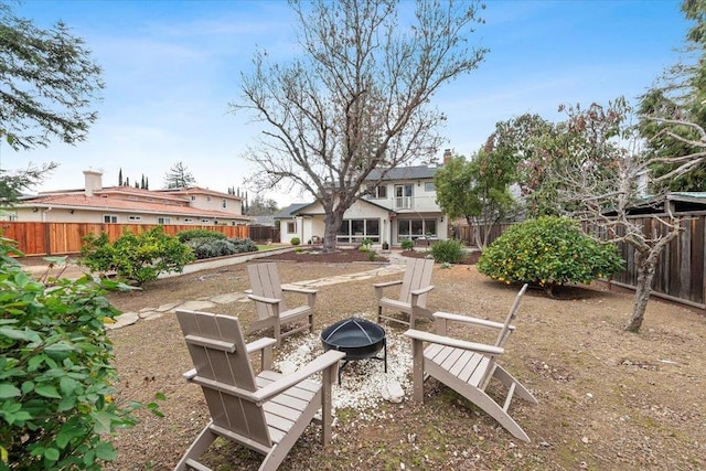 view of yard with an outdoor fire pit