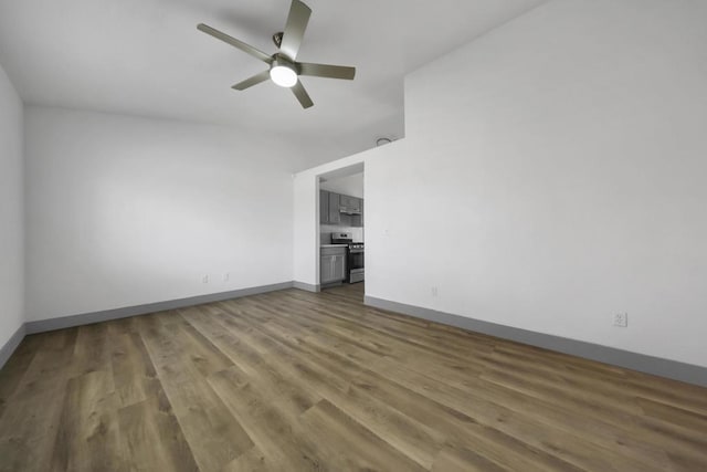 unfurnished room with ceiling fan and dark hardwood / wood-style flooring