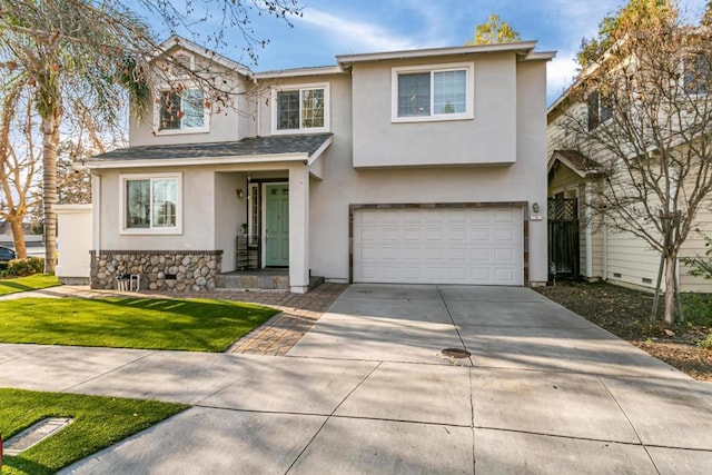 front of property featuring a garage and a front yard