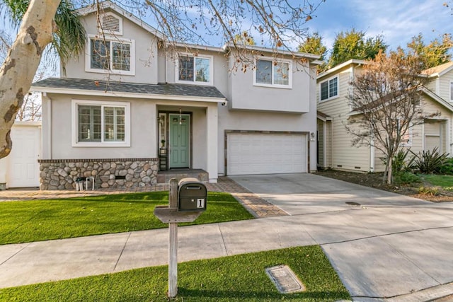 view of front of house with a garage and a front lawn