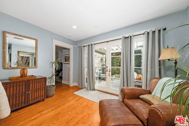 interior space featuring french doors and light wood-type flooring